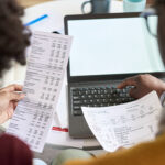 reviewing business finances with laptop and statem 2026 01 11 10 55 57 utc