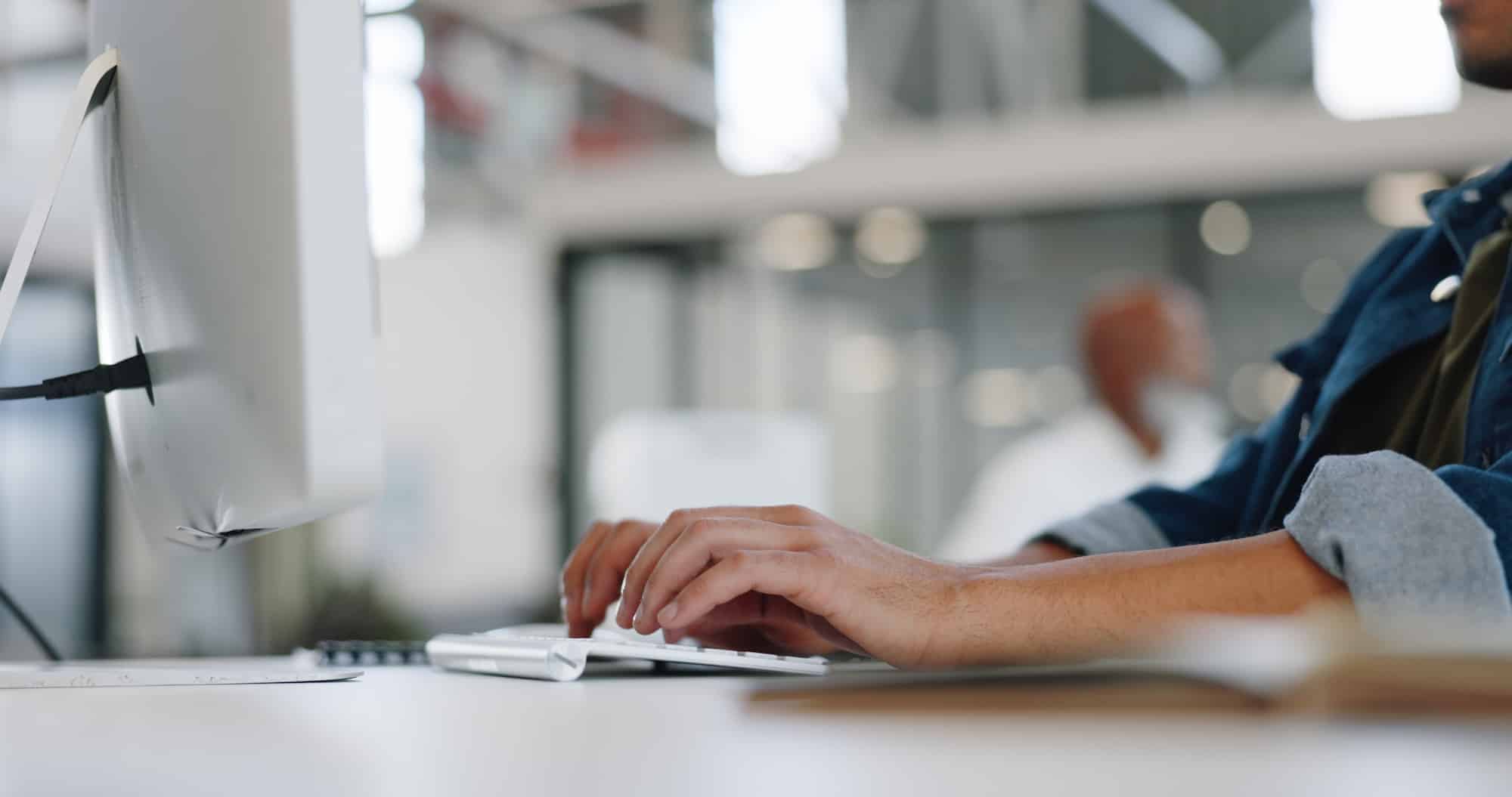 a person writing a behavioral treatment plan on a computer